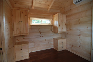 THE BEDROOM HAS EXTRA STORAGE SPACE AND A PRIVACY SLIDER WINDOW